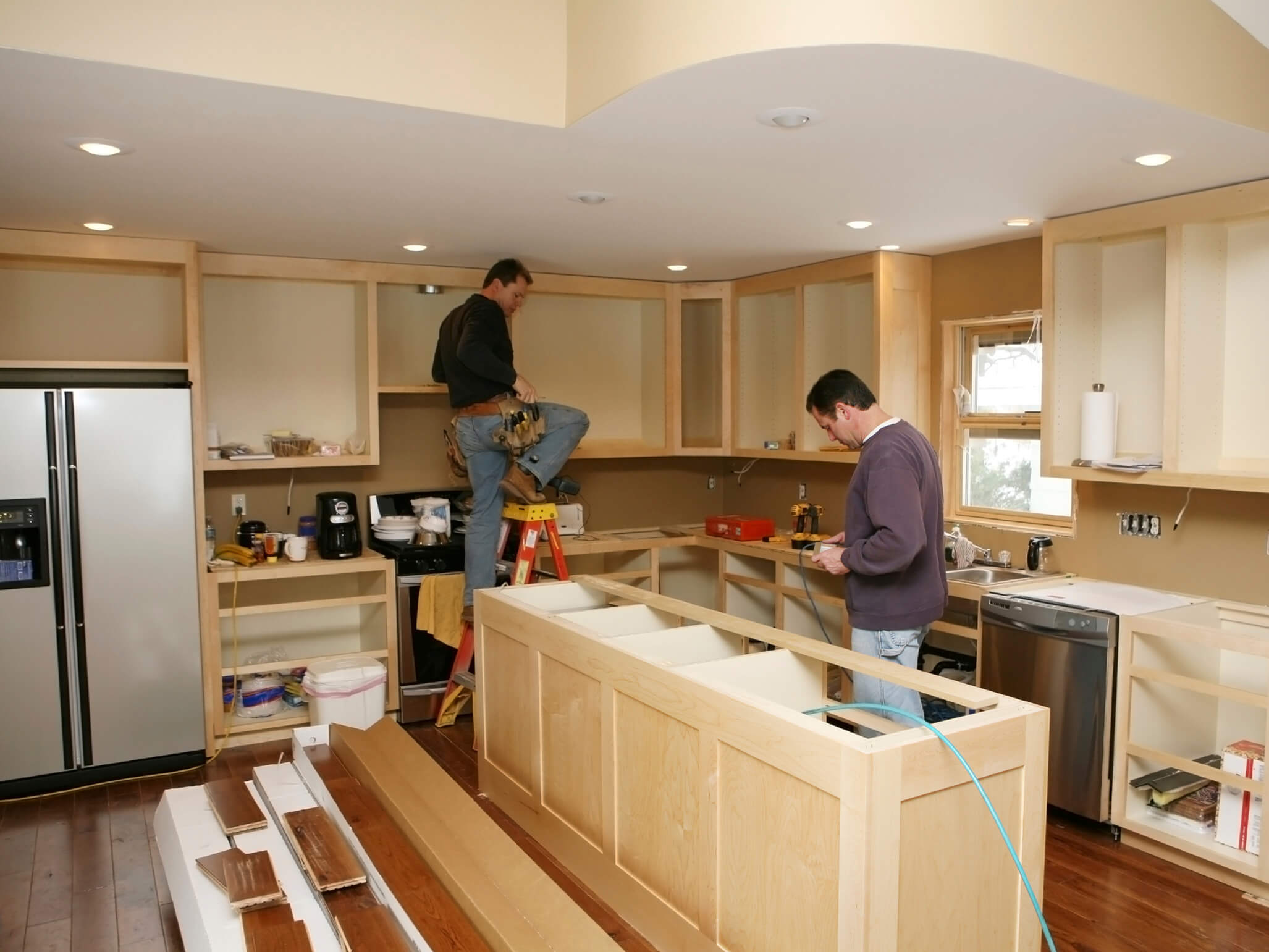 Minnesota home with contractors renovating kitchen
